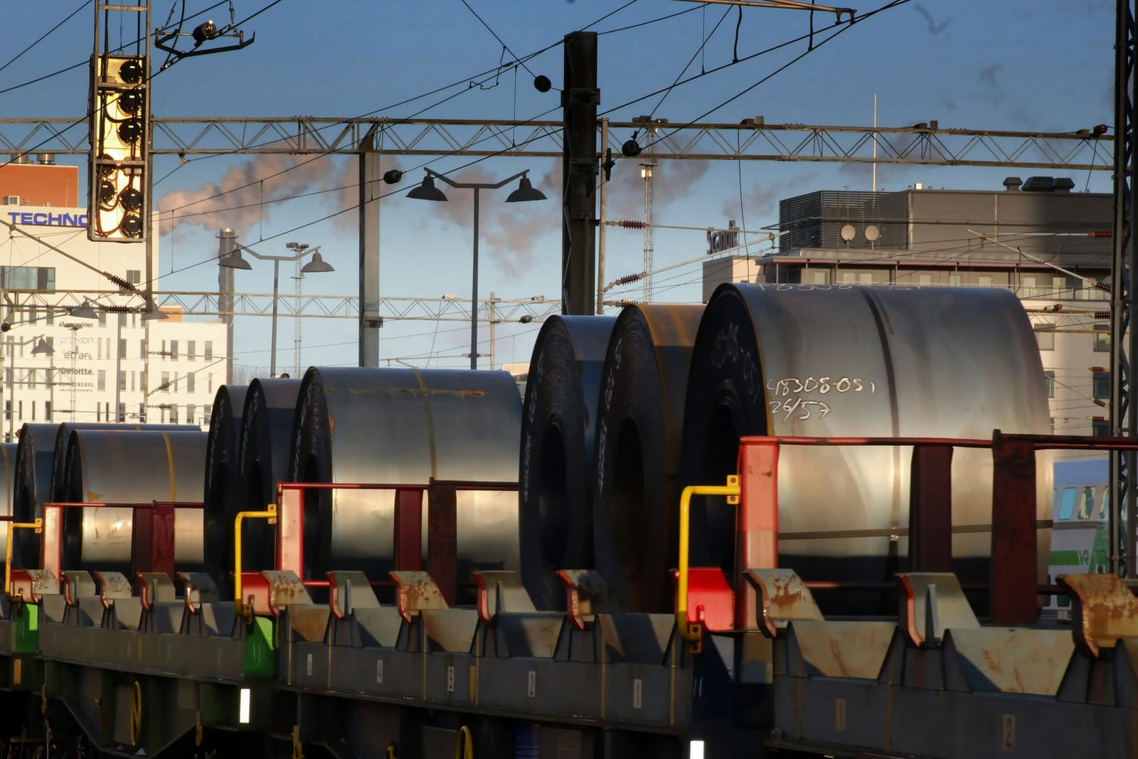 Steel coils loaded and secured on rail wagons